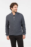 A man wearing a Native World gray half zip textured sweater made from a blend of possum merino wool, paired with black pants.